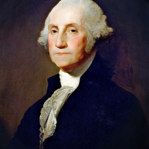 May include: A portrait painting of George Washington, the first president of the United States. He is wearing a dark blue suit with a white lace cravat and has a serious expression on his face.