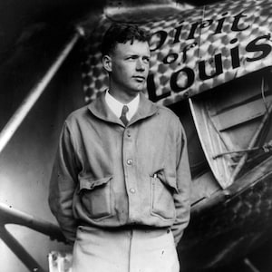 Historical Poster Print: Aviator Charles Lindbergh with his Airplane, Spirit of St. Louis - New Satin Finish Photo - Available in 6 Sizes!