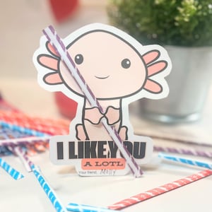 May include: A pink axolotl cartoon character holding a purple and white striped straw. The axolotl is smiling and the text "I like you a lotl" is below the character. The text "Your friend, Molly" is below the text.