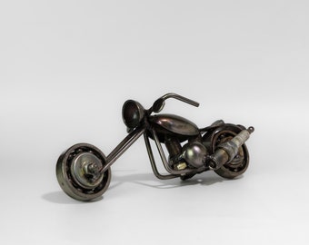 Handmade metal motorcycle sculpture made from recycled items and scrap metal.