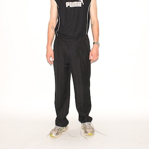 VINTAGE TROUSERS - Vintage 90s striped pleated trousers in black