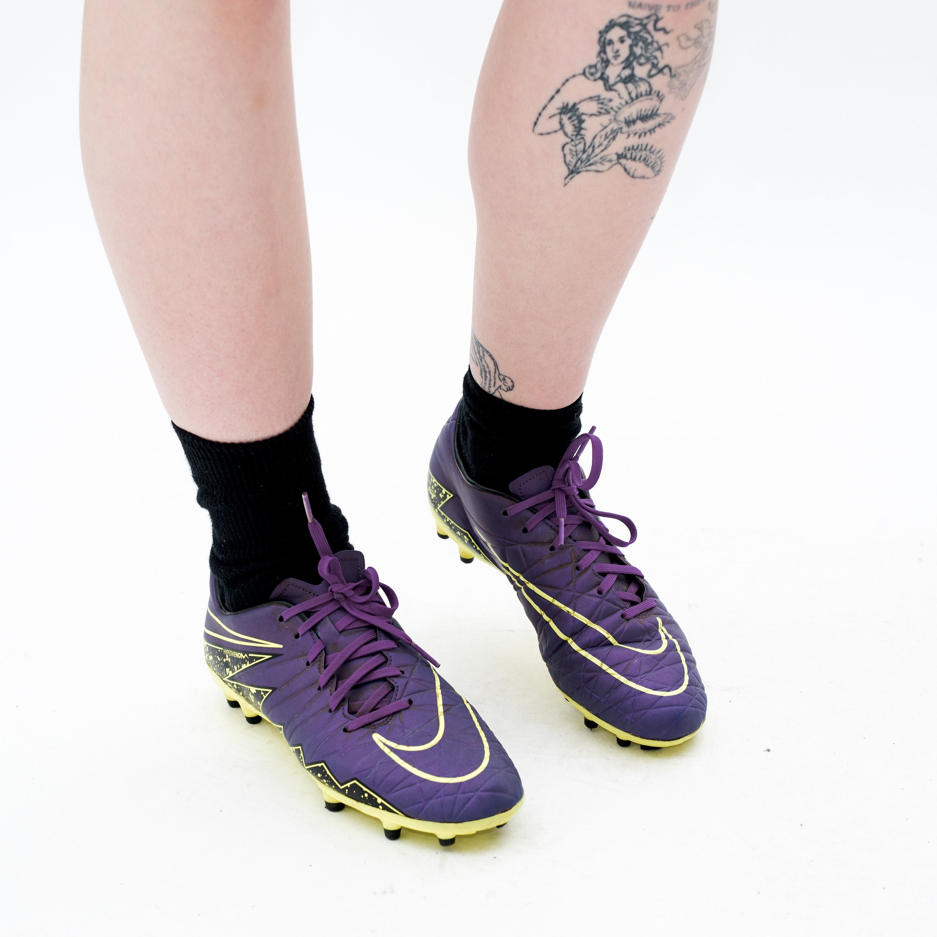 purple and green football boots