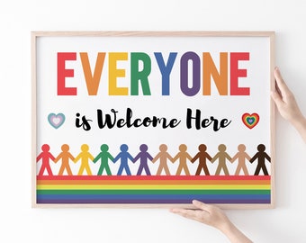 May include: A framed print with the text "EVERYONE is Welcome Here" in rainbow colors. The print features a rainbow stripe at the bottom and a line of paper chain people holding hands in different skin tones.