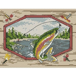 May include: Cross-stitch pattern of a colorful trout jumping out of the water, with a fishing line and fly above it. The scene is framed by a red octagon with a woodgrain background.
