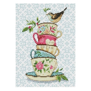 May include: A stack of teacups with floral designs and the words "Love" and "Dream" on them. A small bird sits on the top cup.