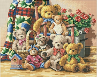 May include: A group of seven teddy bears, some sitting in a wicker basket, others sitting on a wooden floor. The bears are all different colors and have different expressions on their faces. There is a red, white, and blue quilt in the background.