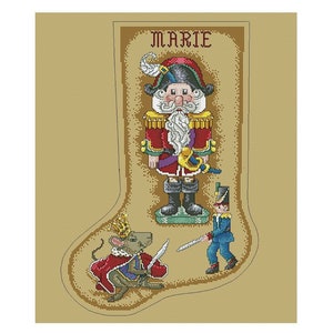 May include: A beige stocking with a nutcracker, a soldier, and a mouse king. The stocking has the name "MARIE" written on it.