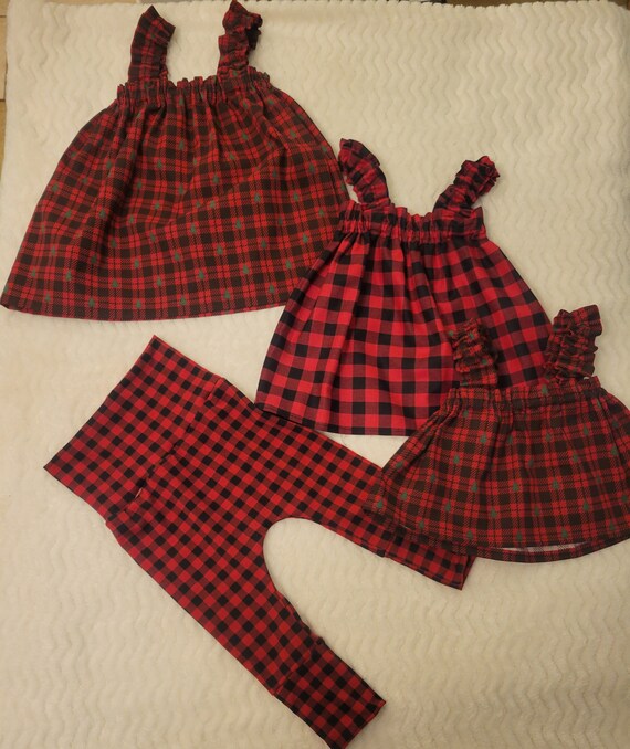 Christmas Dresses and Tops. Ruffled elastic dress, Ruffled elastic tops. High waisted leggings High waisted bummies, embroidered onesie. Christmas Dresses and Tops. Ruffled elastic dress, Ruffled elastic tops. High waisted leggings High waisted bummies, embroidered onesie.
