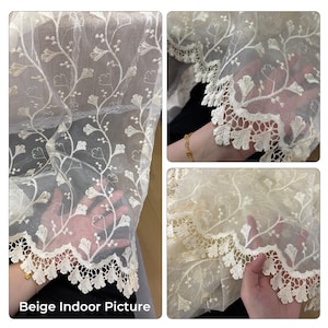 May include: A sheer beige fabric curtain featuring an intricate embroidered floral vine pattern and a scalloped lace border. The lightweight material has a delicate, semi-transparent texture with detailed stitching throughout the botanical design.