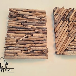 May include: Two square wall art pieces made of driftwood. The piece on the left has a horizontal pattern, while the piece on the right has a diagonal pattern. Both pieces are made of natural driftwood and have a rustic, beachy feel.