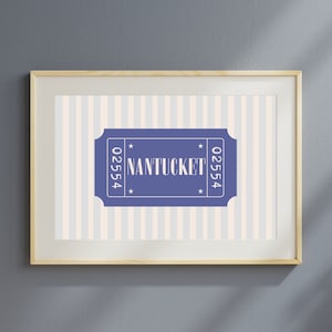 May include: A framed print with a blue and white striped background and a blue ticket with the text "NANTUCKET 02554" in white.