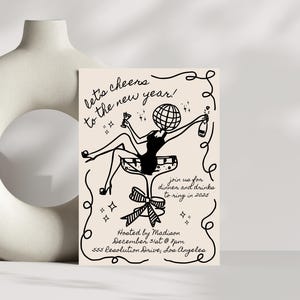 May include: A black and white illustration of a person with a disco ball head sitting in a champagne glass. The text "let's cheers to the new year!" is at the top of the image. The text "join us for dinner and drinks to ring in 2025" is in the middle of the image. The text "Hosted by Madison December 31st @ 7pm 555 Resolution Drive, Los Angeles" is at the bottom of the image.