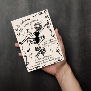 May include: A black and white illustration of a woman wearing a dress and a globe for a head, holding a glass of champagne and a bottle of champagne. The illustration is on a cream-colored card with the text "let's cheers to the new year!" and "join us for dinner and drinks to ring in 2025". The card also includes the text "Hosted by Madison December 31st @ 8pm 555 Resolution Drive, Los Angeles".