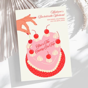May include: A pink and red illustrated cake with white frosting and red cherries. The text "She's The Cherry On Top" is written on the cake. The image is for a bachelorette party.