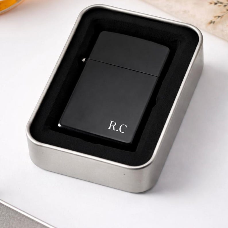 Black metal petrol lighter with flip lid, modern matte finish, personalised with initials