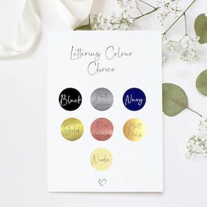 May include: A chart with lettering color choices for a personalized item. The colors include black, matt silver, navy, gold, rose gold, matt gold, and nude.