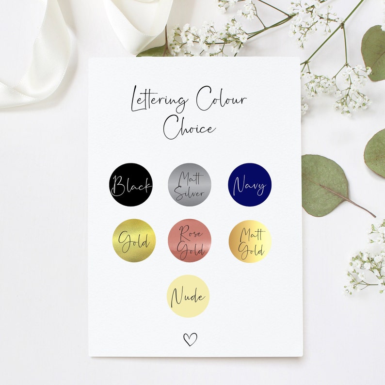 May include: A chart with lettering color choices for a personalized item. The colors include black, matt silver, navy, gold, rose gold, matt gold, and nude.