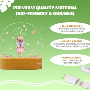 May include: A personalised acrylic night light featuring a fairy illustration and the name "Eljah" and date "15.04.2014". The night light has a wooden base and includes a remote control.
