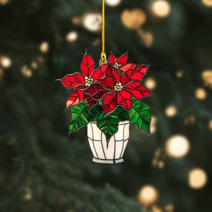Roter Weihnachtsstern als festlicher Fensterbehang