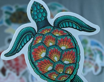 May include: A teal and red sea turtle sticker with a detailed design. The turtle's shell is made up of intricate, overlapping patterns in shades of red, orange, and yellow.