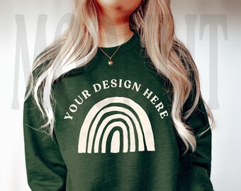 May include: A dark green sweatshirt with a white rainbow graphic and the text "YOUR DESIGN HERE".