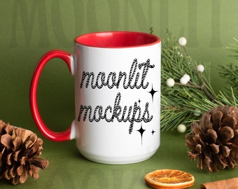 May include: White ceramic mug with a red rim and handle. The mug has the text "moonlit mockups" written in black rope-like font with small stars on the side.