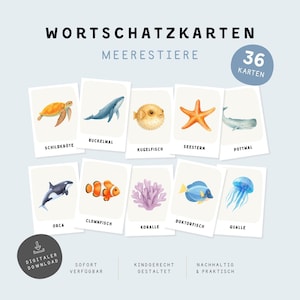 May include: A set of 36 educational flashcards titled WORTSCHATZ KARTEN MEERESTIERE featuring watercolour illustrations of marine life including a sea turtle, whale, pufferfish, starfish, orca, clownfish, coral, tang fish, and jellyfish with German labels.