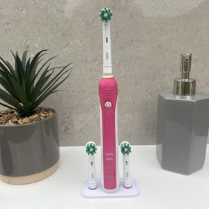 Soporte para cepillo de dientes Oral B y dos cabezales de cepillo