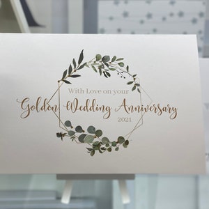 Une carte d’anniversaire de mariage en or joliment décorée, cadre géo avec des gemmes d’or, personnalisée avec 2023