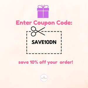 May include: A pink gift box with a white bow and a coupon code for 10% off your order. The coupon code is SAVE10DN.