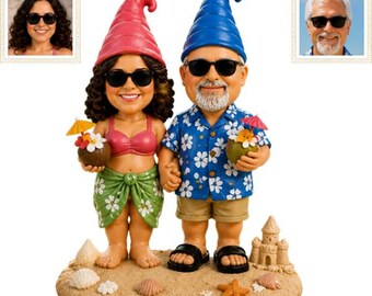 May include: A custom figurine set featuring two gnomes on a sandy base with a sandcastle and starfish. The female gnome wears a pink bikini top, green floral sarong, and sunglasses, holding a coconut drink. The male gnome wears a blue floral shirt, tan shorts, and sunglasses, holding a coconut drink.