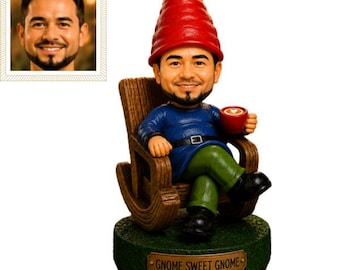 May include: A custom bobblehead figurine of a man with a beard wearing a red gnome hat, a blue long-sleeved shirt, and green pants. The figure sits in a brown wooden rocking chair holding a red mug and stands on a green base with the text GNOME SWEET GNOME.