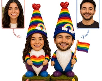 May include: Two custom bobblehead figurines featuring faces based on provided photos. Each gnome wears a rainbow-striped hat with a red heart topper and a rainbow patch. One gnome holds a rainbow heart, the other a rainbow flag. Bases read EMILY and JAMES.