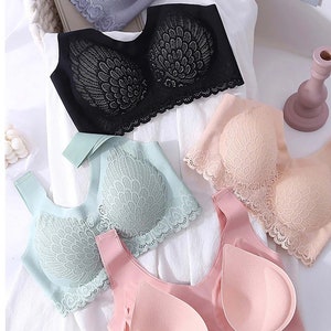 May include: Four different lace bras in various colors, including black, gray, pink, and light blue. The bras have a delicate lace design and are made of a soft, comfortable material.