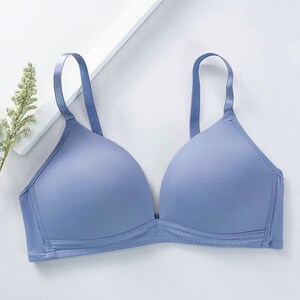 May include: A light blue bra with adjustable straps. The bra has a smooth, seamless design.