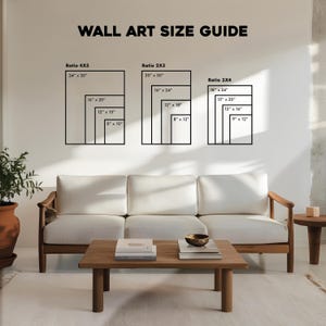 May include: A wall art size guide with dimensions in inches. The guide displays various rectangular sizes, including 24" x 30", 16" x 20", and 12" x 15" for the 4X5 ratio. The text "WALL ART SIZE GUIDE" is at the top. A sofa and coffee table are in the foreground.