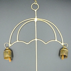 Wind chime in the shape of a copper-clad umbrella handmade with hanging bells.