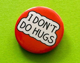 I don&#39;t do hugs badge, pocket pebble, magnet or keyring.  Social distancing badge for people that are not huggers.