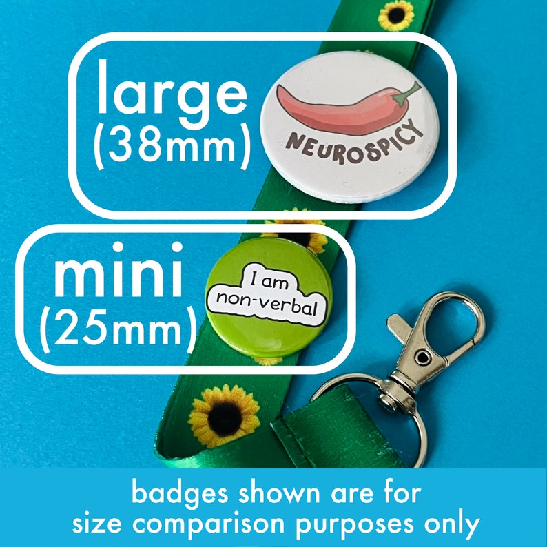 May include: A green lanyard with sunflower patterns and a silver clasp. Two button badges are shown for size comparison: a large 38mm badge with a chili pepper and the text "NEUROSPICY", and a mini 25mm badge with the text "I am non-verbal".