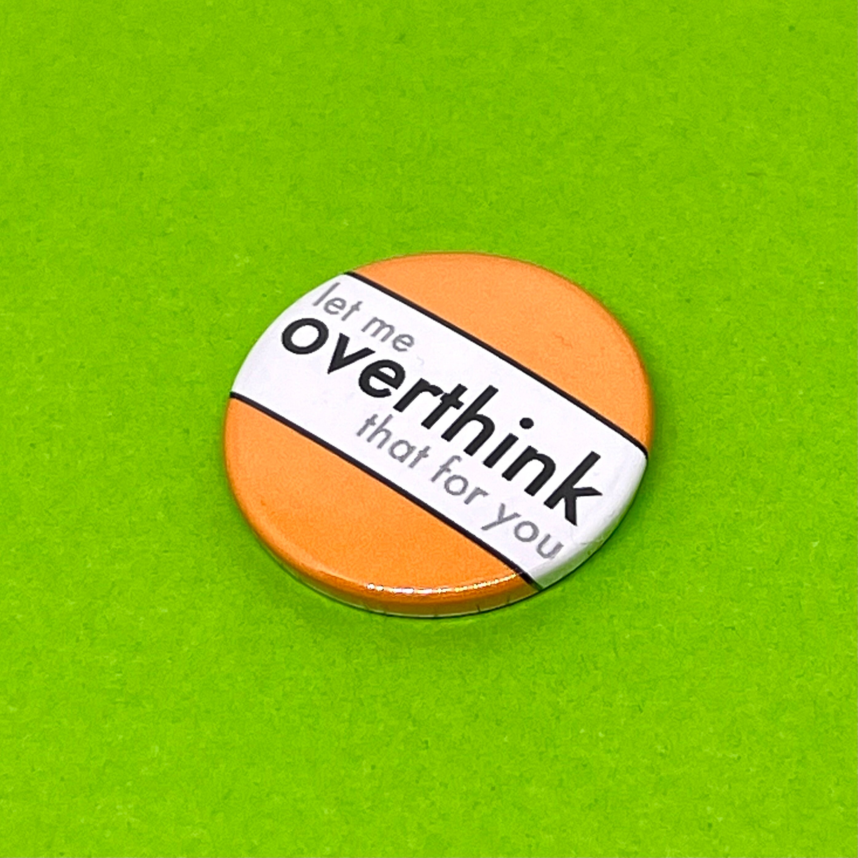 Let me overthink that for you.  Badge, pocket pebble, magnet or keyring.