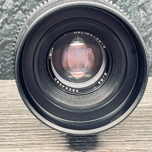 May include: A black camera lens with the text "HELIOS-44-2" and "58/2" printed on it.