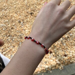 Red and black beaded flower bracelet