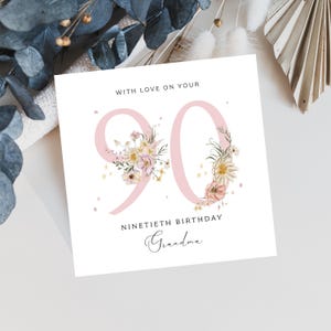 May include: A white card with pink floral numbers "90" and the text "With love on your ninetieth birthday Grandma".