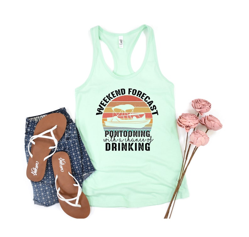 May include: A mint green tank top with a black graphic of a sunset with a pontoon boat and the text "Weekend Forecast Pontooning with a chance of Drinking".