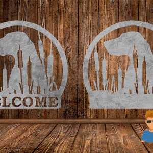 May include: Two metal signs with a silhouette of a dog in a field of cattails. The sign on the left says "WELCOME".