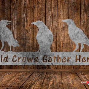 May include: Metal wall art featuring three crows perched on a sign that reads "Old Crows Gather Here". The crows are silhouetted against a woodgrain background.