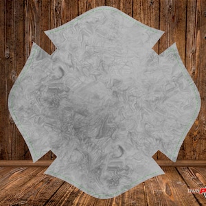 May include: A gray, four-pointed star shape with a wood grain pattern. The star is cut out of a material that looks like wood.