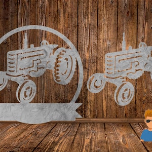 May include: Two metal tractor cutouts. One is a standalone tractor, and the other is inside a circle with a banner at the bottom. The cutouts are silver and set against a wooden background.