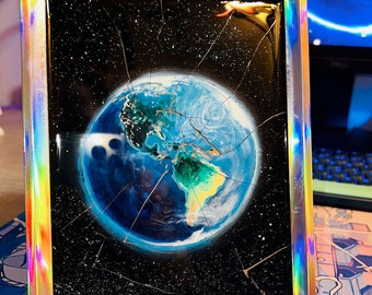 Acrylic painting called "a broken earth" (about 6' x 8 in) on broken glass.