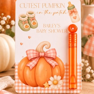May include: A rectangular card featuring the text CUTEST PUMPKIN in the patch and BAILEY'S BABY SHOWER, decorated with illustrations of baby booties, a bottle, and a pumpkin with a bow. An orange bubble wand is attached to the right side.
